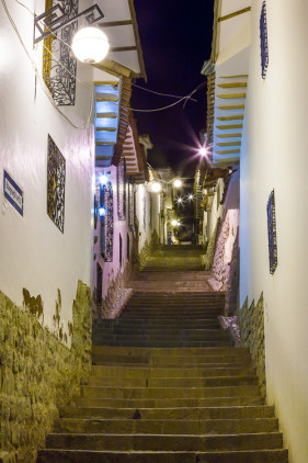 Small alleyway at night in San Blas neighborhood of Cusco, Peru, South America