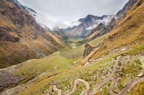 View looking down the ascent to Salkantay Pass towards base-camp en route to Machu Picchu, near Mollepata, Peru