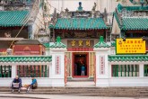Elderly couple in front of Man Mo Temple, Hong Kong