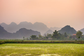 Karst landscape and rice fields near Tam Cốc village at sunset, Hoa Lư District, Ninh Bình Province, Vietnam