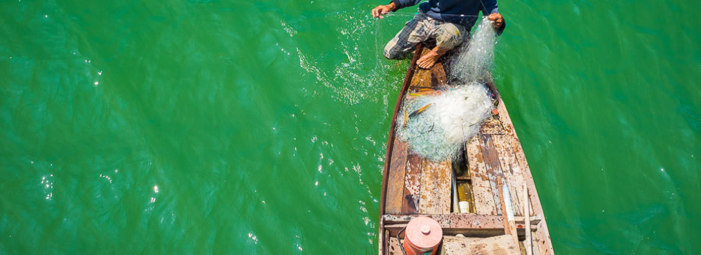 Vietnamese man fishing on the Thu Bon River, Quang Nam Province, Vietnam