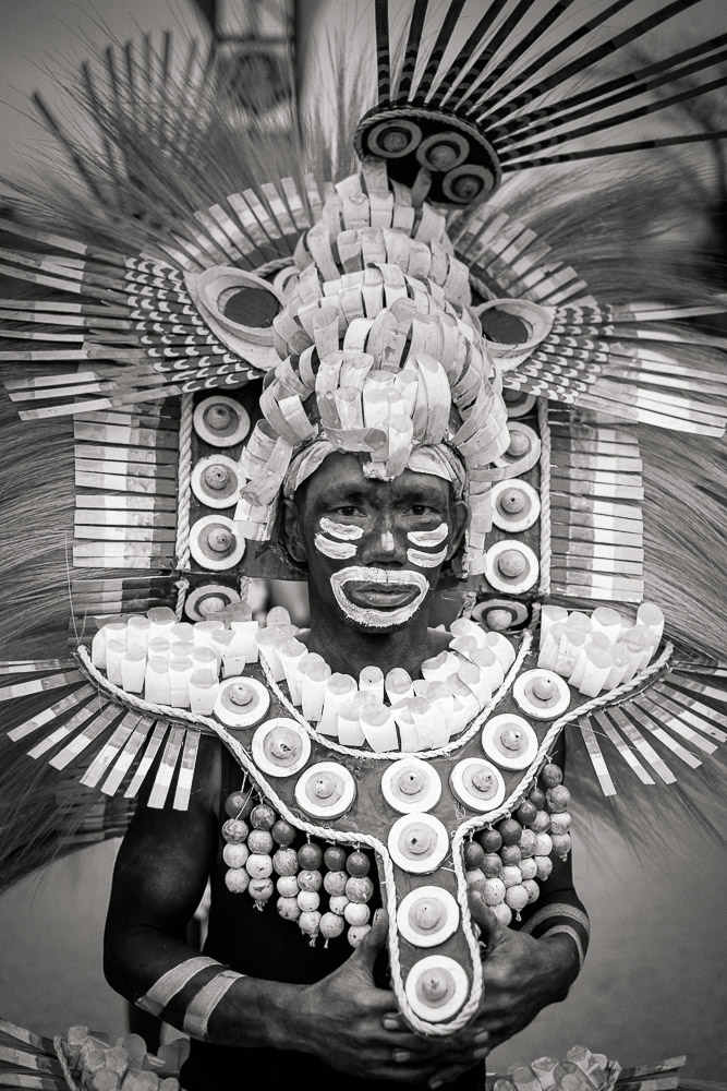 Kalibo, Philippines, 17 January, 2015. A participant in the Ati-atihan parade wearing brighly-colored home-made costume made from natural and salvaged materials. Ati-Atihan festival in honor of Santo Niño takes place yearly in Kalibo, Aklan, Western Visayas, Philippines.