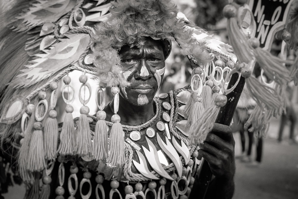 A participant in the Ati-atihan parade wearing a hand-made-made costume made from natural and salvaged materials. Ati-Atihan festival in honor of Santo Niño takes place yearly in Kalibo, Aklan, Western Visayas, Philippines.