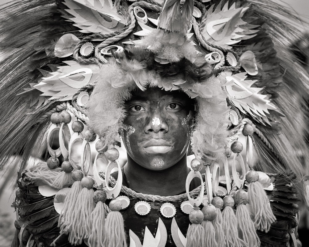 A participant in the Ati-atihan parade wearing a hand-made-made costume made from natural and salvaged materials. Ati-Atihan festival in honor of Santo Niño takes place yearly in Kalibo, Aklan, Western Visayas, Philippines.