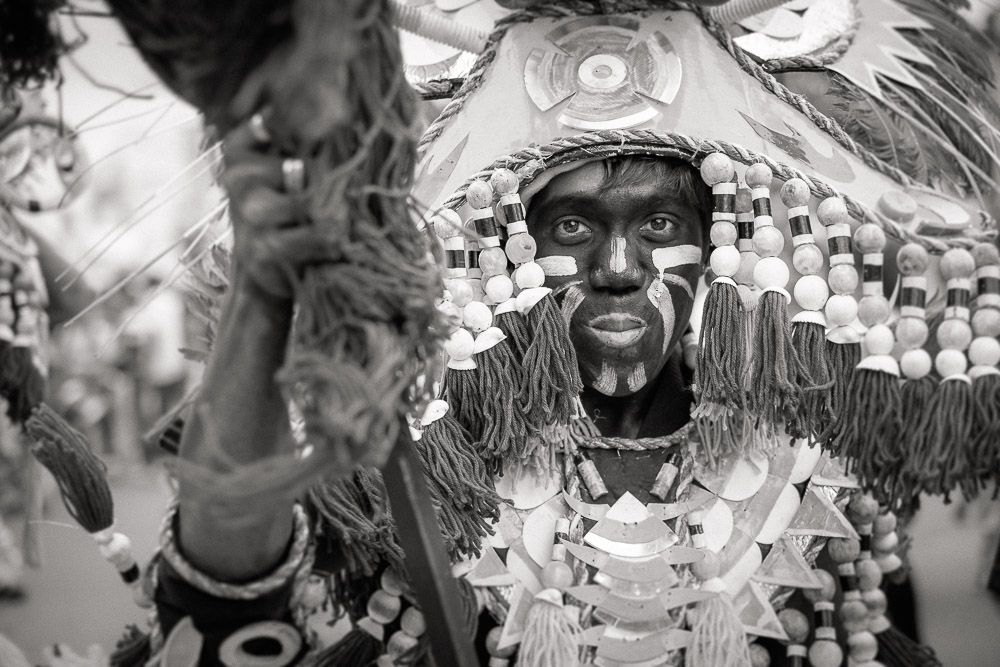 A participant in the Ati-atihan parade wearing a hand-made-made costume made from natural and salvaged materials. Ati-Atihan festival in honor of Santo Niño takes place yearly in Kalibo, Aklan, Western Visayas, Philippines.