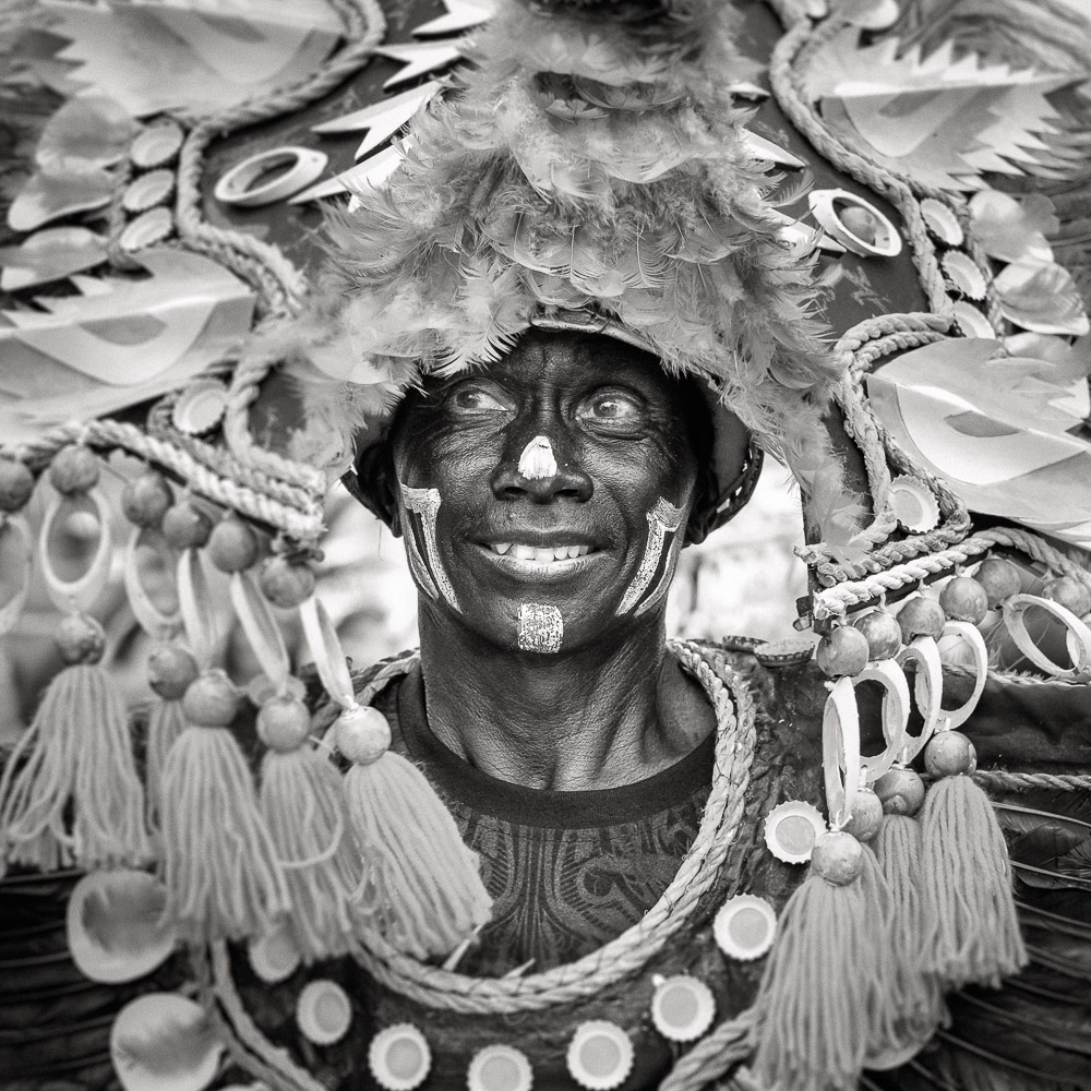 A participant in the Ati-atihan parade wearing a hand-made-made costume made from natural and salvaged materials. Ati-Atihan festival in honor of Santo Niño takes place yearly in Kalibo, Aklan, Western Visayas, Philippines.