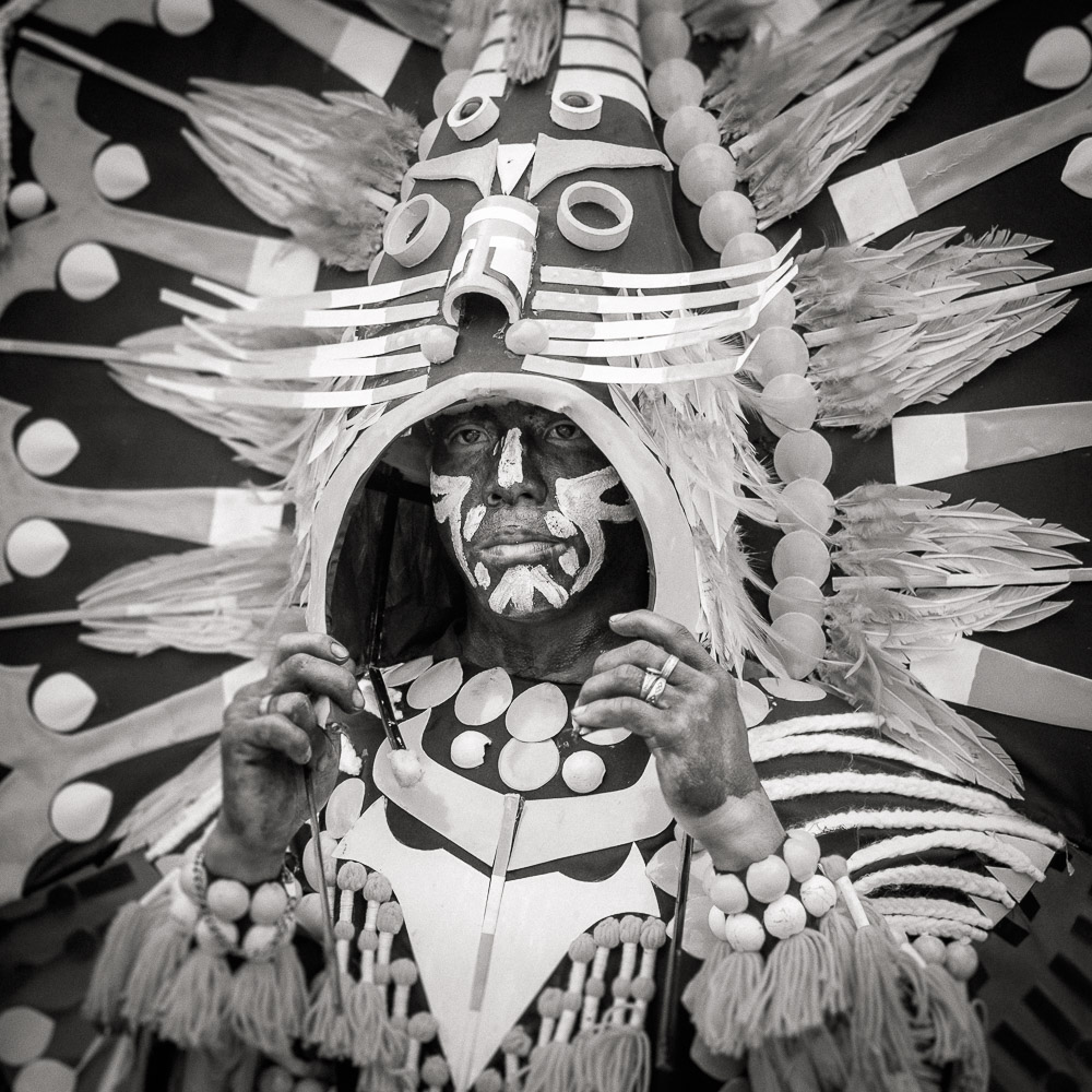 A participant in the Ati-atihan parade wearing a hand-made-made costume made from natural and salvaged materials. Ati-Atihan festival in honor of Santo Niño takes place yearly in Kalibo, Aklan, Western Visayas, Philippines.