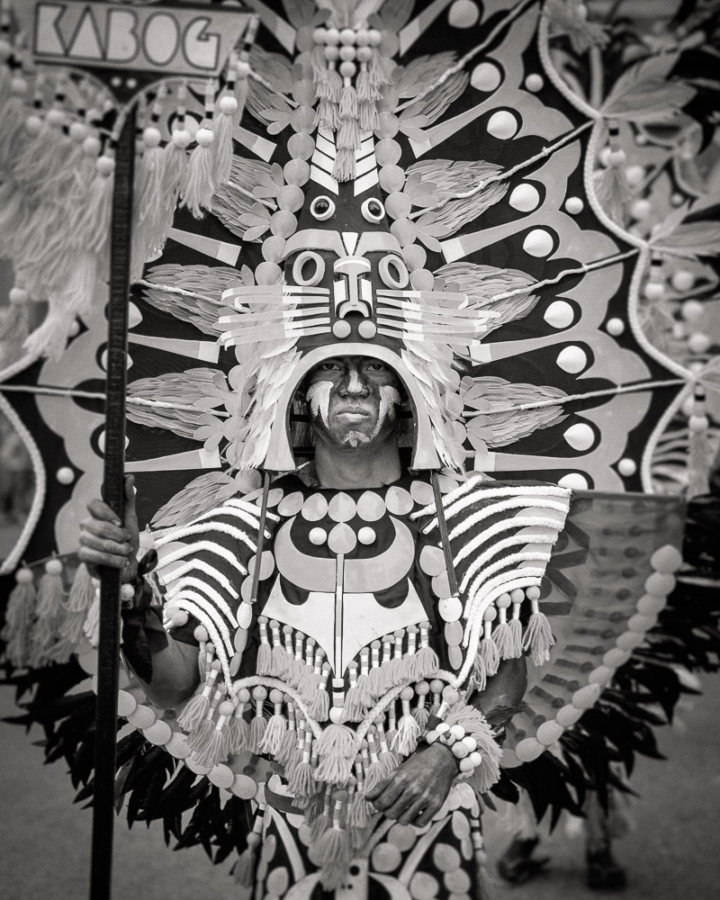 A participant in the Ati-atihan parade wearing a hand-made-made costume made from natural and salvaged materials. Ati-Atihan festival in honor of Santo Niño takes place yearly in Kalibo, Aklan, Western Visayas, Philippines.