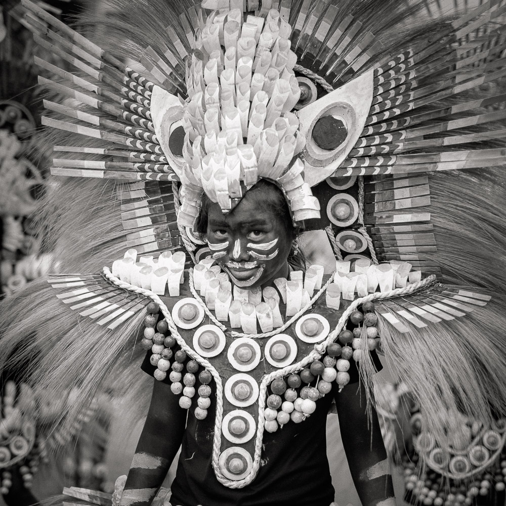 A participant in the Ati-atihan parade wearing a hand-made-made costume made from natural and salvaged materials. Ati-Atihan festival in honor of Santo Niño takes place yearly in Kalibo, Aklan, Western Visayas, Philippines.