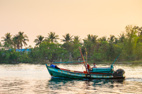 Fishing boat on the Kampot River at sunset, Kampot, Kampot Province, Cambodia