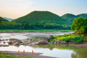 Monks at confluence of Nam Khan River and Mekong River, Luang Prabang, Louangphabang Province, Laos