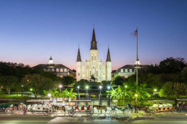 United States, Louisiana, New Orleans, French Quarter. Jackson Square and St. Louis Cathedral at dusk.